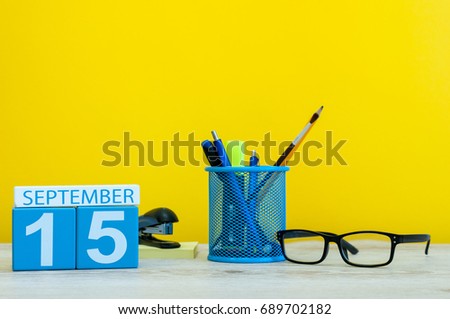15th September. Image of september 15, calendar on yellow background with office supplies. Fall, autumn time