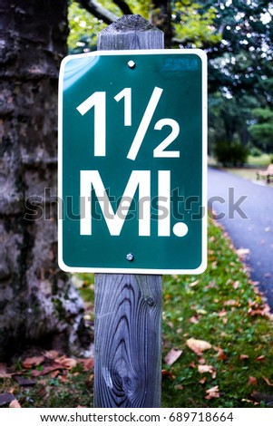 1 1/2 miles sign in park