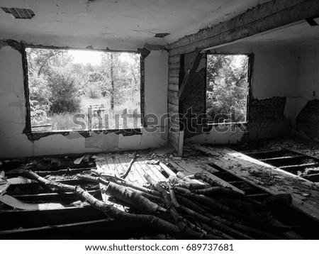 Abandoned old ruined house, a Ghost (black-and-white photo)