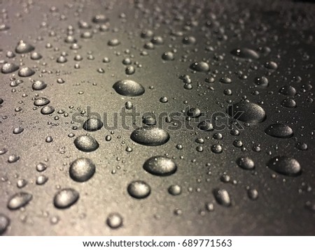 Rain drops on metal sheet (taken by mobile phone camera)