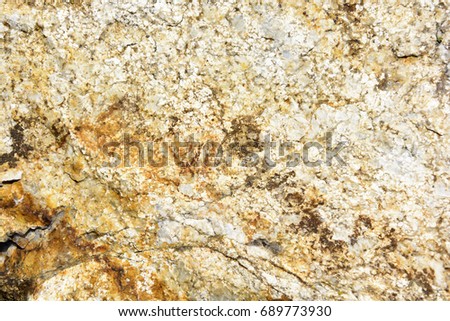 Natural texture of a dark yellow rock. Texture of rock