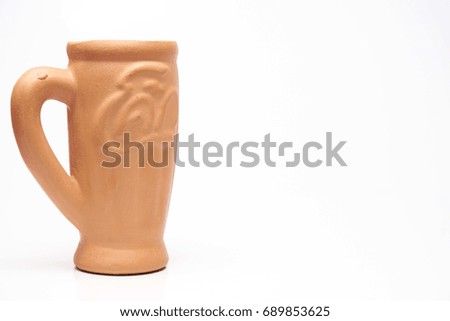 Clay mug isolated on white background.