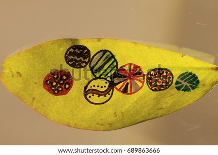 the art painting on green leaf  and brown background