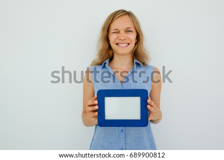 Happy Lady Winking and Holding Empty Picture Frame