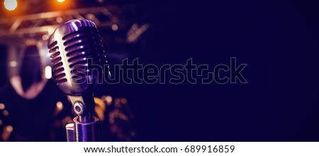 Close-up of retro microphone at concert in nightclub