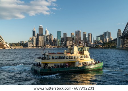generic modern cityscape with ferry in daytime blue sky, Sydney city with landmark skyscraper skyline