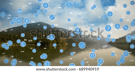 Full frame shot of blue computer icons against mountain range reflecting on river against sky