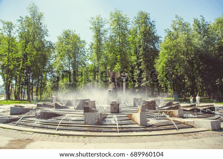 Park in the city center in bright sunny summer weather