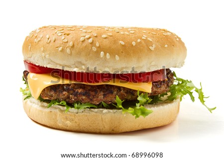 Cheeseburger in sesame seeded bun isolated on white.