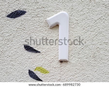 House number on the wall one (1)