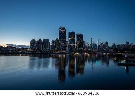 generic modern cityscape with water reflection in twilight morning, harbour city with skyscraper skyline