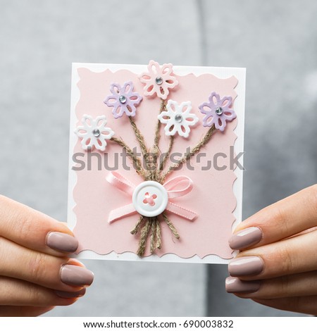 woman received beautiful postcard. Symbol of holiday, affection, greetings, Valentines Day and love