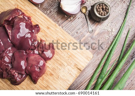 Chicken liver on a wooden cutting board
