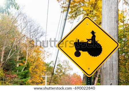 Traffic Sign Warning against Tractors in the Road in a Rural Area of Massachusetts