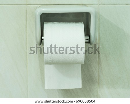 Tissue roll in toilet room.