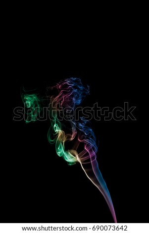 The color smoke moving on dark background.