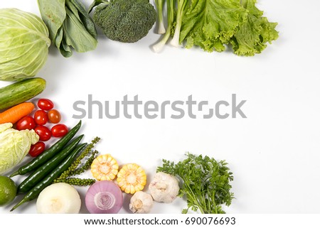 Fresh organic vegetables on white background .