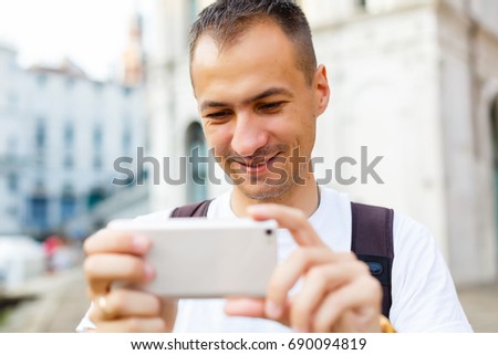 Man makes a photo on the phone