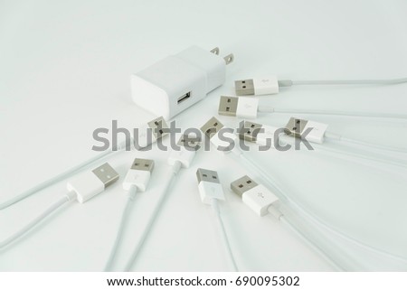 USB cable for the web on a white background, computer peripherals, or power supply for smartphones connected to the adapter