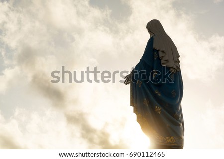 Silhouette of virgin Mary statue Royalty-Free Stock Photo #690112465