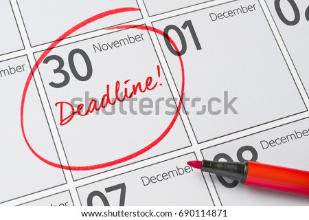 Deadline written on a calendar - November 30 Royalty-Free Stock Photo #690114871