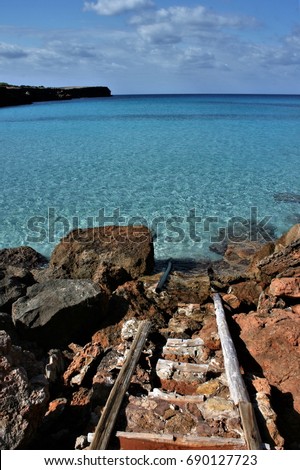 Old pier,Formentera, Balearic Islands, blue sea,Mediterranean sea, favorite destination of foreign tourists in Spain