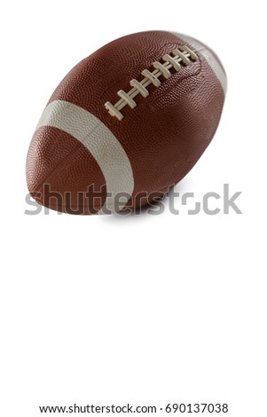 Close up of brown American football on white background