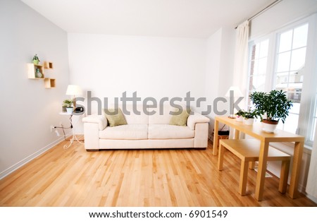 modern day living room with beige couch Royalty-Free Stock Photo #6901549