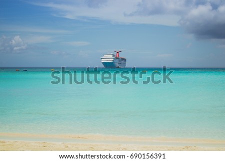 Cruise ship at Bahamas Island with blue water and kayaks