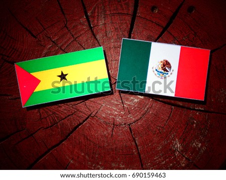 Sao Tome and Principe flag with Mexican flag on a tree stump isolated