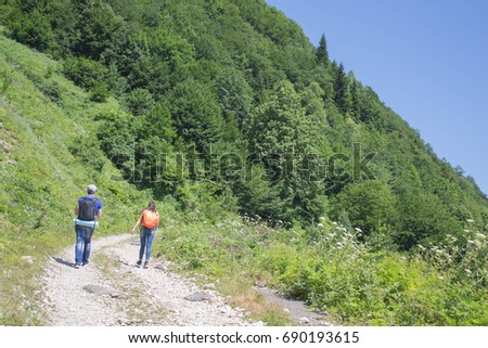 Active and healthy lifestyle on summer vacation and weekend tour. Active hikers. Travel adventure and hiking activity. Two young Tourists With Backpacks travel
