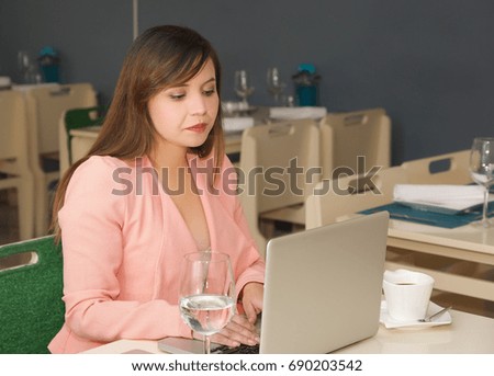 Close upf of a young beautiful businesswoman working. Business concept