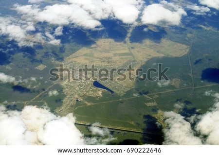 Aerial view - Clouds over western Russia at spring time - from great height.