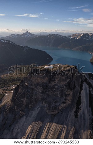 Aerial landscape view of Table Mountain with Garibaldi Lake in the Background. Picture taken from an airplane near Squamish,  North of Vancouver, British Columbia, Canada.