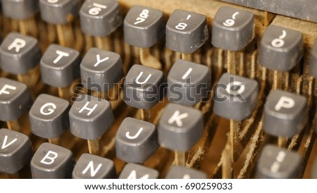 The antique alphabets typewriter was technology for  making documents ago. The picture concepts are education, history, antique, conservative, human tools.