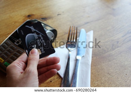 tap pay credit card coronavirus covid 19 ban concept -contactless payment card pdq background copy space with hand holding credit card to pay at cafe restaurant coffee shop smartcard stock photograph