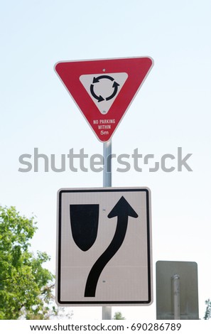 Roundabout sign in residential area