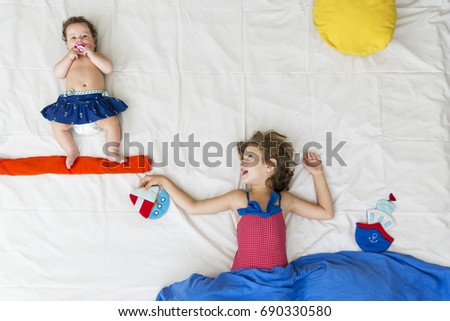 two little girls resting in the sea