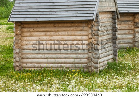 Summer landscape with a wooden small house
