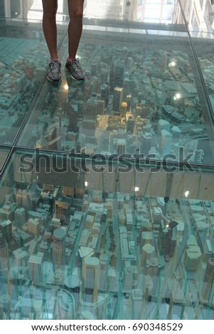 Downtown at your feet, a model of a city placed under glass