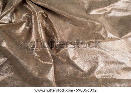 Texture, background. Crafted product from animal skins. the skin of the animal with shiny deposited structure. Decorative skins.