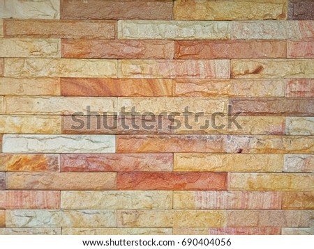 Closed up orange stone brick texture, block wallpaper.