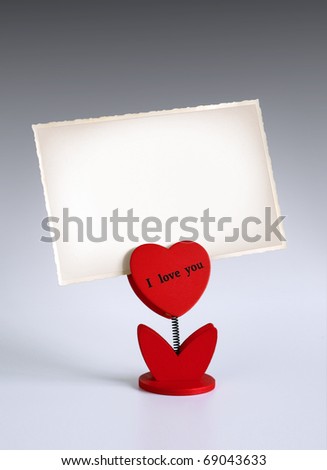 heart-shaped photo holder saying I Love You holding photo