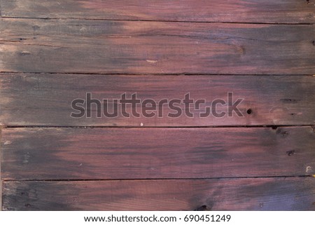 Wooden background. Texture, the surface of the old boards from natural wood with different shades of black and dark brown. The top view. Close-up. The stock photos.