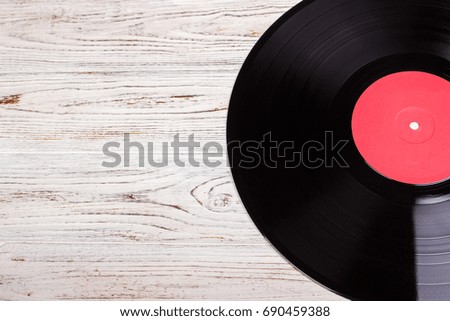 vinyl record in wood background, vinyl disc