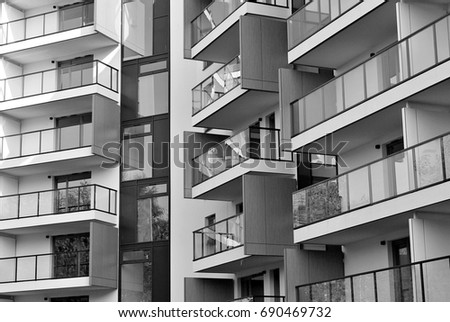 Modern, luxury apartment building. Black and white.