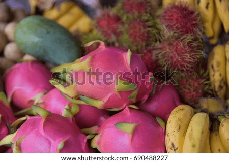 Dragon fruits with background of fruits.