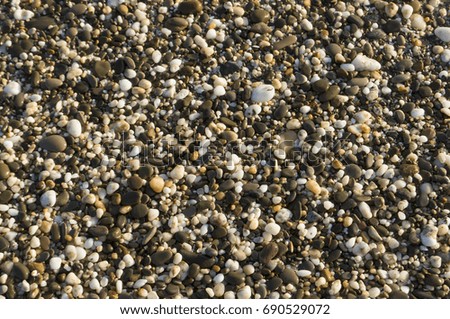 Small smooth pebbles texture background.