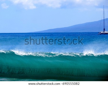 Large Wave Cresting on the Shore of Maui with Boat and Island in Background        
