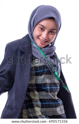 A pretty muslim businesswoman wearing hijab and suit  isolated on white background